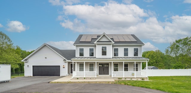 917 N Grand St, Suffield, CT 06093 - modern inspired farmhouse with covered porch, a standing seam roof, driveway, an attached garage, and a shingled roof