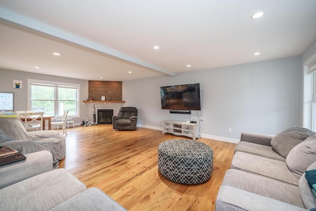 917 N Grand St, Suffield, CT 06093 - living room with a fireplace, recessed lighting, light wood-type flooring, baseboards, and beamed ceiling