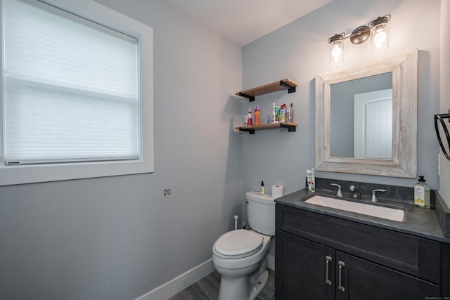 917 N Grand St, Suffield, CT 06093 - bathroom featuring toilet, vanity, and baseboards