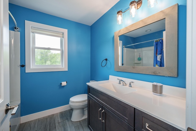 917 N Grand St, Suffield, CT 06093 - full bath with baseboards, a shower with curtain, vanity, and toilet