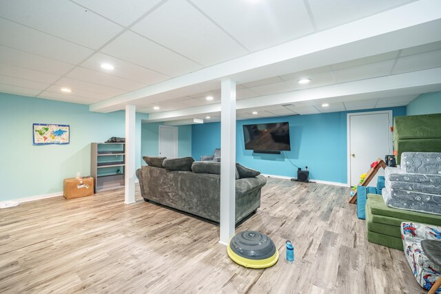 917 N Grand St, Suffield, CT 06093 - living area with wood finished floors, baseboards, a paneled ceiling, and recessed lighting