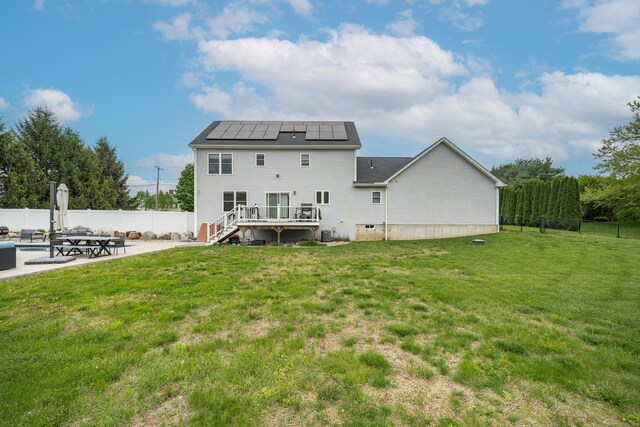 917 N Grand St, Suffield, CT 06093 - rear view of house with a patio, a deck, solar panels, and stairway