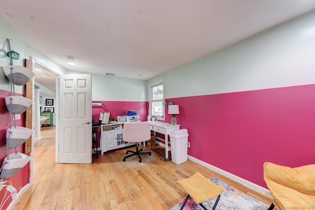 office with wood finished floors and baseboards