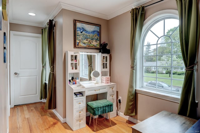 home office with light wood finished floors, ornamental molding, baseboards, and recessed lighting
