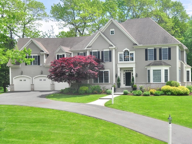 21 Pheasant Hill Rd, Canton, CT 06019 - view of front of property featuring driveway, a garage, a front yard, and a shingled roof