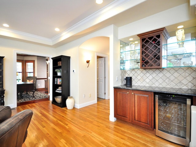 21 Pheasant Hill Rd, Canton, CT 06019 - indoor dry bar featuring beverage cooler, ornamental molding, backsplash, baseboards, and light wood finished floors