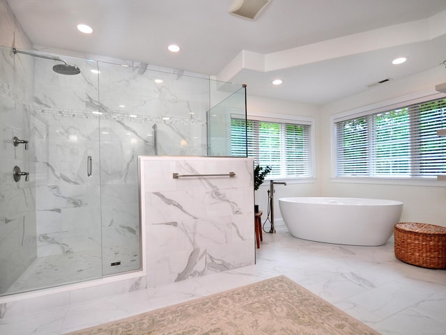 21 Pheasant Hill Rd, Canton, CT 06019 - full bath with marble look tile flooring, a marble finish shower, a freestanding tub, and recessed lighting