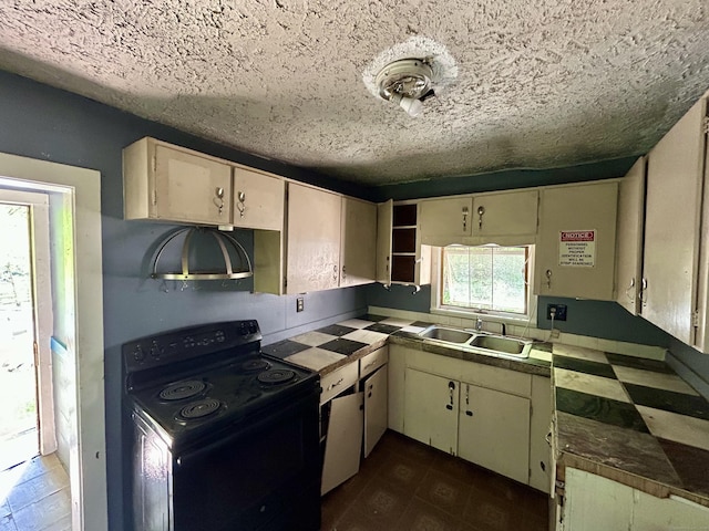 16 River Pl, Norfolk, CT 06058 - kitchen with electric range, a sink, a textured ceiling, and cream cabinetry