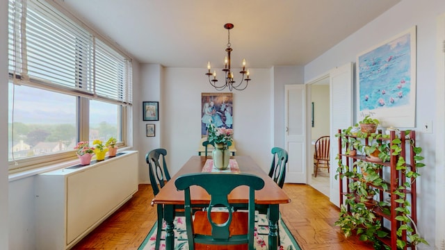 dining space with a chandelier