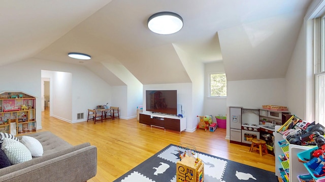 rec room featuring lofted ceiling and wood finished floors