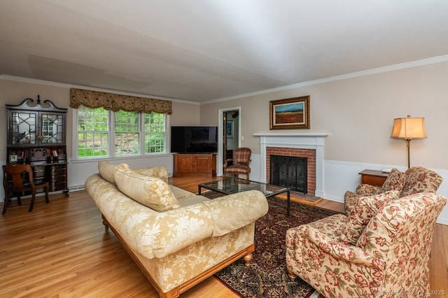 7 Indian Trl, Woodbridge, CT 06525 - living room featuring wood finished floors, crown molding, a brick fireplace, and wainscoting