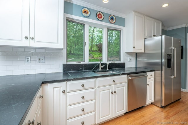 7 Indian Trl, Woodbridge, CT 06525 - kitchen featuring appliances with stainless steel finishes, crown molding, a sink, white cabinets, and light wood finished floors