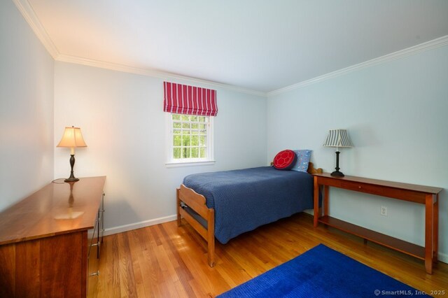 7 Indian Trl, Woodbridge, CT 06525 - bedroom with ornamental molding, wood finished floors, and baseboards