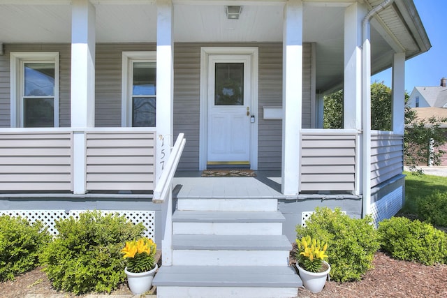 property entrance with covered porch