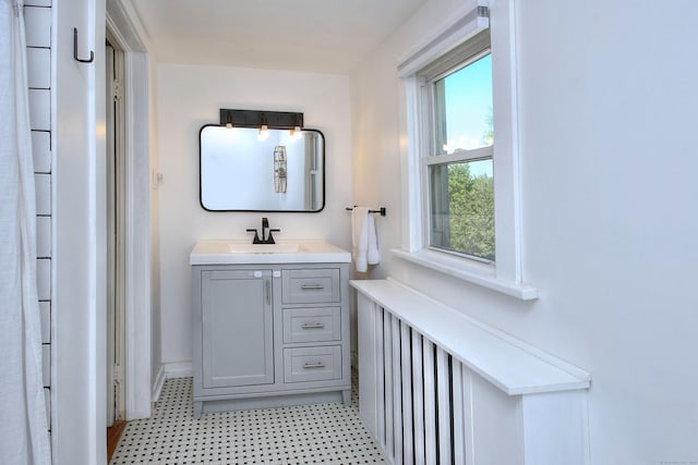 bathroom with vanity and baseboards