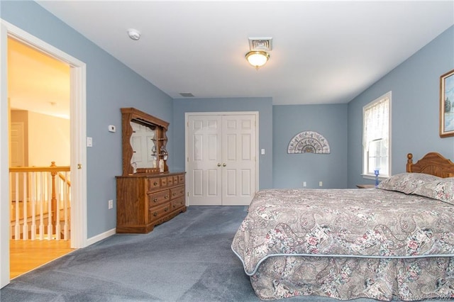 bedroom with carpet flooring, a closet, and baseboards