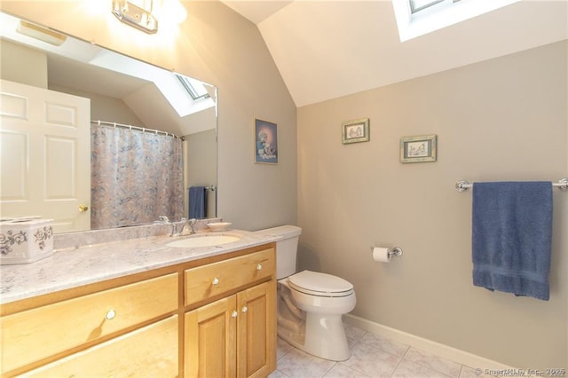 full bath with a skylight, vaulted ceiling, toilet, vanity, and tile patterned floors