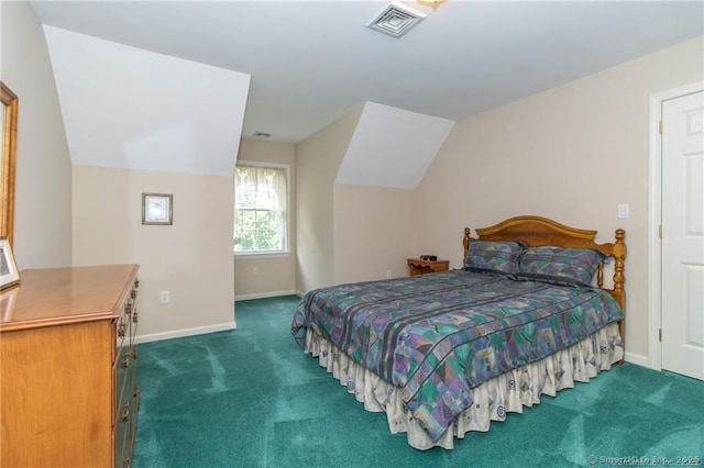 carpeted bedroom with baseboards and lofted ceiling