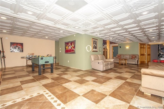 recreation room featuring an ornate ceiling and light tile patterned floors