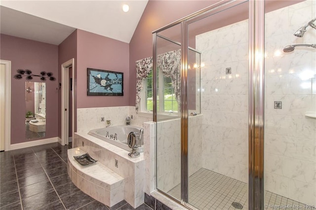 full bathroom with tile patterned floors, a garden tub, a shower stall, and vaulted ceiling