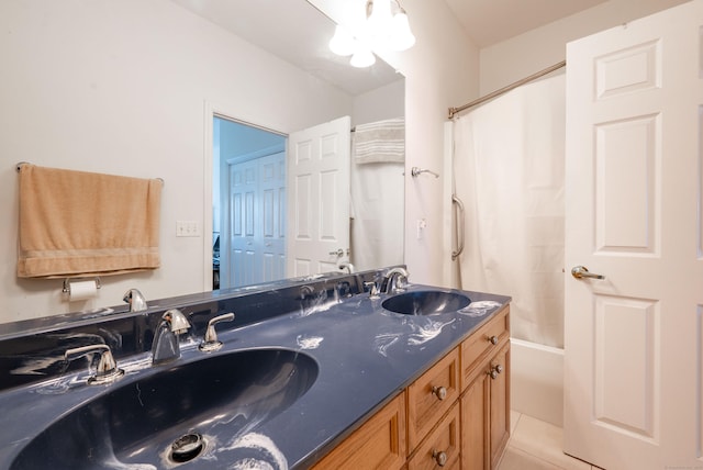 full bath with tile patterned flooring, double vanity, and shower / bathtub combination
