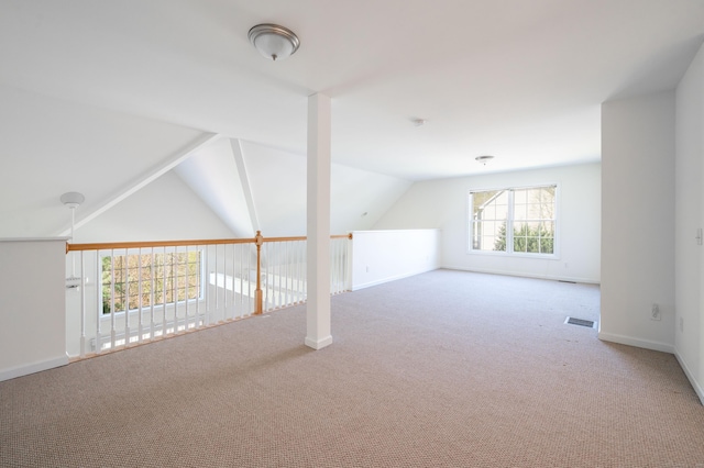 bonus room with carpet, vaulted ceiling, and baseboards