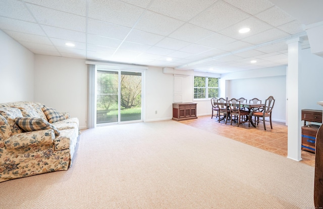 living area featuring light colored carpet, a drop ceiling, and recessed lighting