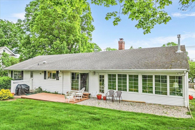 42 N Main St, Essex, CT 06426 - back of property with a chimney, a lawn, and a deck