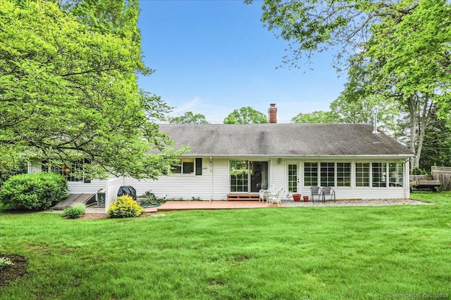 42 N Main St, Essex, CT 06426 - rear view of property with a chimney, a yard, roof with shingles, and a deck