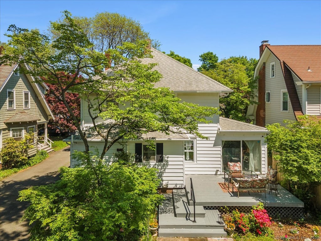 34 Filbert St, Hamden, CT 06517 - rear view of house with a wooden deck and roof with shingles