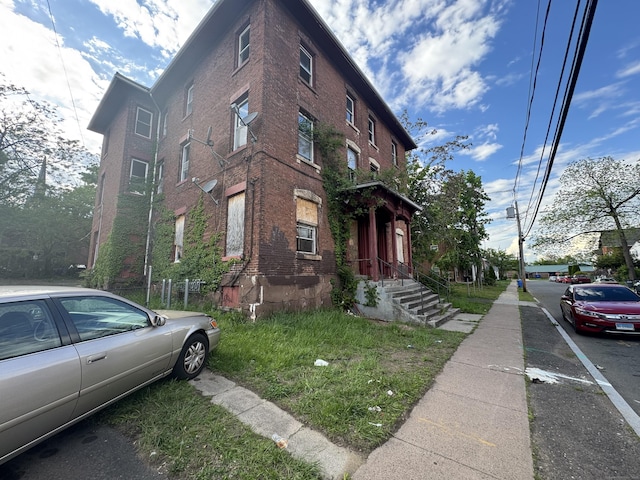 149 Wooster St, Hartford, CT 06120 - view of home's exterior featuring brick siding