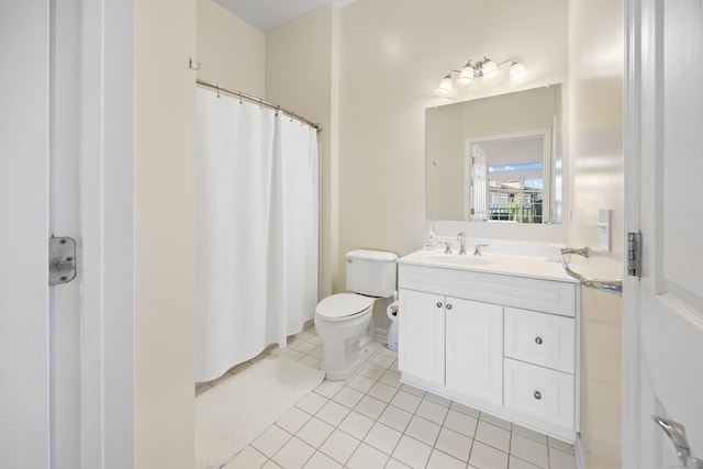 bathroom featuring tile patterned floors, toilet, vanity, and a shower with curtain
