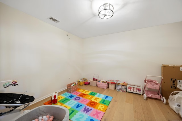 recreation room with wood finished floors