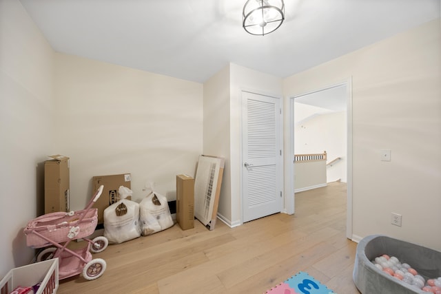 miscellaneous room featuring wood finished floors and baseboards