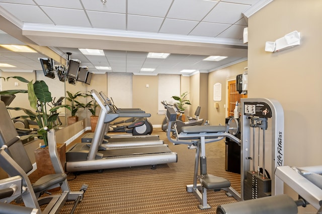 gym with a paneled ceiling and crown molding