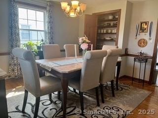 65 Dale Rd, Wethersfield, CT 06109 - dining area featuring a chandelier and wood finished floors