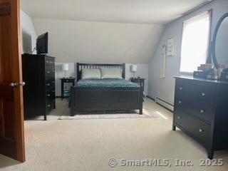 65 Dale Rd, Wethersfield, CT 06109 - carpeted bedroom featuring lofted ceiling and baseboard heating