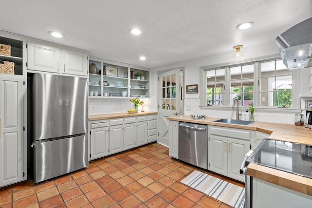 17 Fernridge Rd, West Hartford, CT 06107 - kitchen with appliances with stainless steel finishes, a sink, backsplash, wall chimney range hood, and open shelves