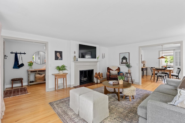 17 Fernridge Rd, West Hartford, CT 06107 - living room with light wood finished floors, a fireplace, and baseboards