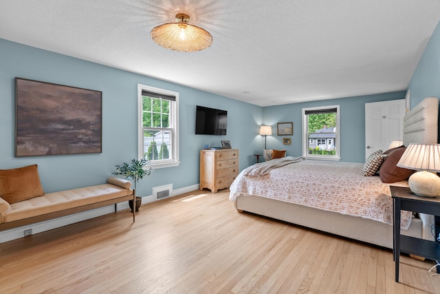 17 Fernridge Rd, West Hartford, CT 06107 - bedroom with multiple windows, hardwood / wood-style flooring, and baseboards