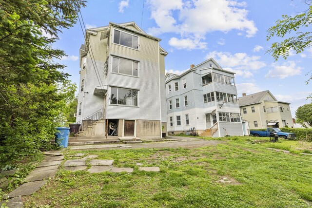29 Cabot St, New Britain, CT 06053 - back of property featuring a yard and entry steps