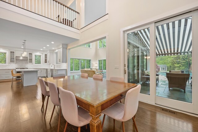 43 Hunting Ridge Rd, Greenwich, CT 06831 - dining area featuring wood finished floors, recessed lighting, and a high ceiling
