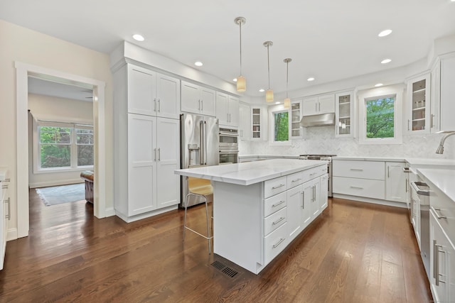 43 Hunting Ridge Rd, Greenwich, CT 06831 - kitchen with high end appliances, white cabinets, a center island, a sink, and recessed lighting