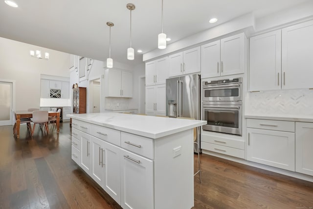 43 Hunting Ridge Rd, Greenwich, CT 06831 - kitchen with appliances with stainless steel finishes, recessed lighting, a kitchen island, light countertops, and white cabinets