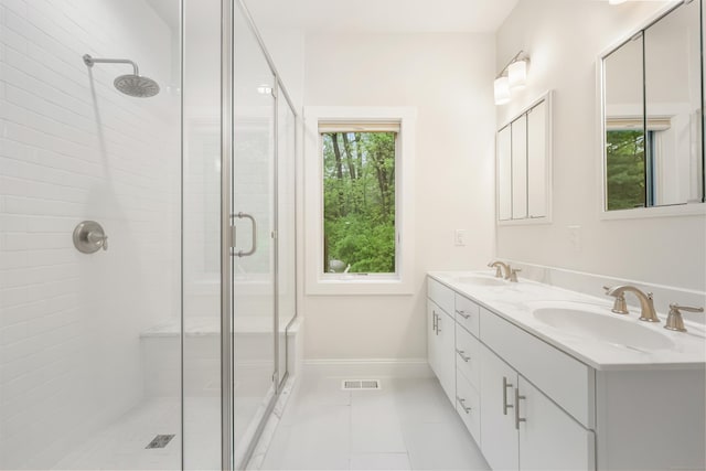 43 Hunting Ridge Rd, Greenwich, CT 06831 - bathroom with a stall shower, double vanity, tile patterned floors, and baseboards