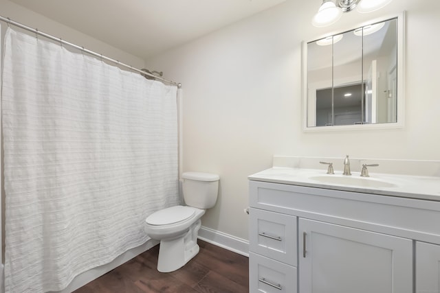 43 Hunting Ridge Rd, Greenwich, CT 06831 - full bath with wood finished floors, toilet, vanity, baseboards, and a shower with curtain