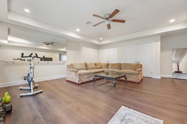 43 Hunting Ridge Rd, Greenwich, CT 06831 - living room featuring a raised ceiling, ceiling fan, baseboards, wood finished floors, and recessed lighting