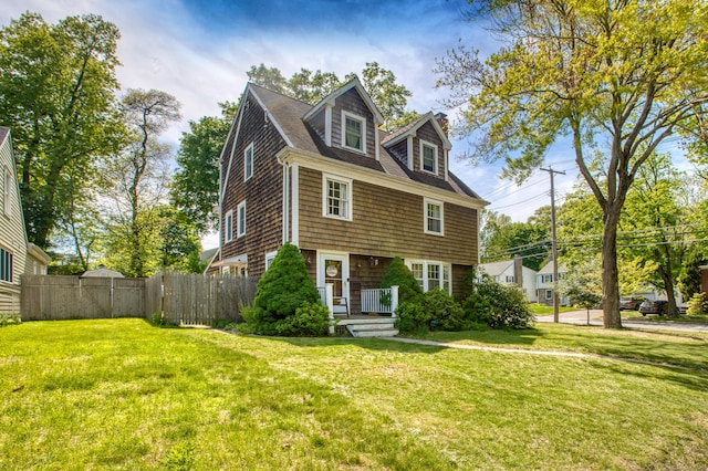 view of front of property featuring roof with shingles