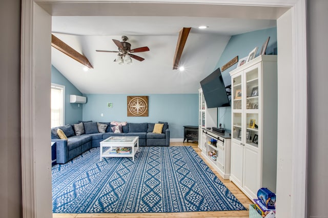 living area with light wood-type flooring, ceiling fan, and a wall mounted air conditioner