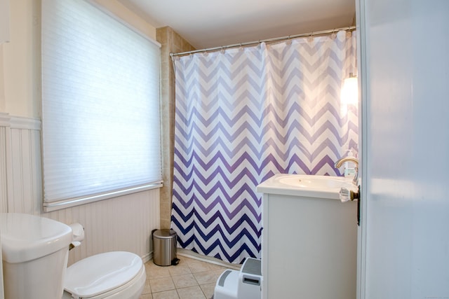 bathroom with tile patterned flooring, toilet, vanity, and a shower with shower curtain